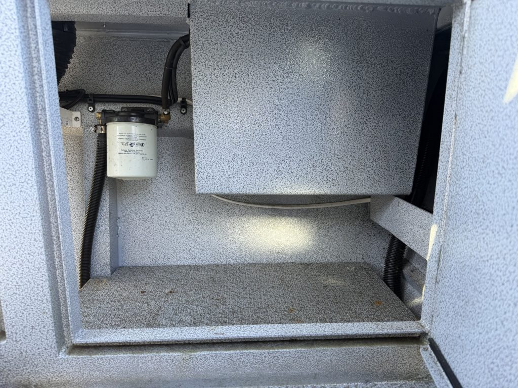 Center console storage with water-separating fuel filter